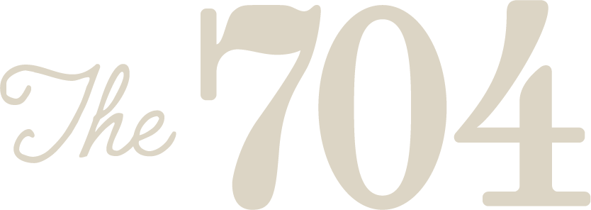 704 at the Quarter 704 at the Quarter Logo